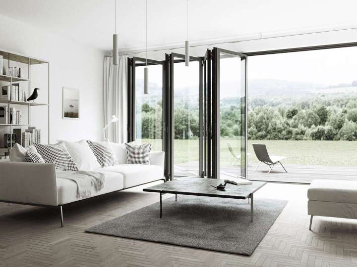 Mit der Glas-Faltwand ist das Wohnzimmer ist zu einer luftigen Freilichtbühne geworden. Komplett geöffnet verbindet sie den Wohnraum mit der anliegenden Terrasse.  Bildnachweis: Solarlux GmbH